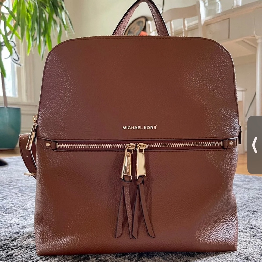 Authentic Michael Kors Rhea slim leather backpack in the color Acorn.